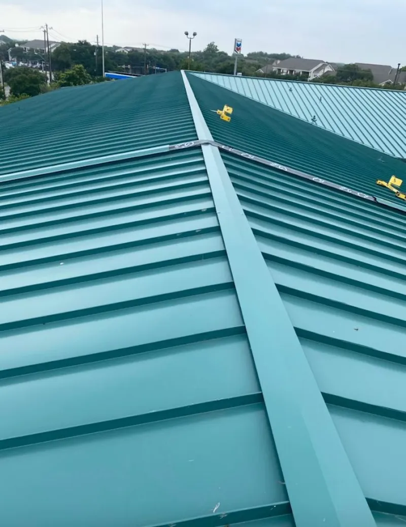 Green commercial metal roof ridge and valley for Metal Roof Repair in Kerrville