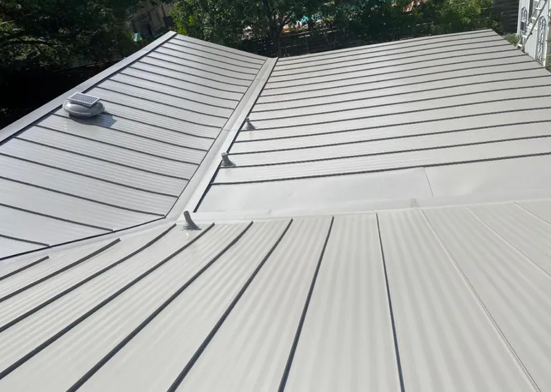 Solar attic fan installed on a metal roof for Roof Ventilation in Kerrville
